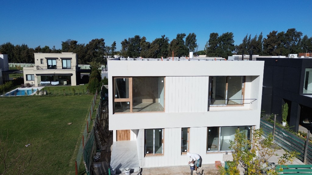 Carpinchos Lote 402 — vista aérea, pileta y obra